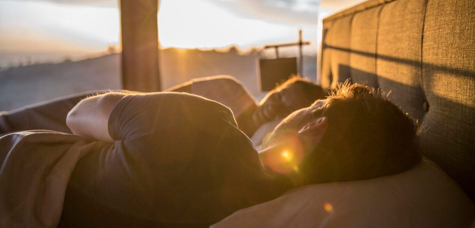 Couple glamping sunrise bed